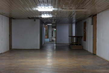 Long dark corridor in an old industrial building