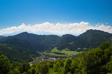 Fototapeta na wymiar Resort Town Szczawnica in summer at Three Crowns Massif Background. Pieniny Mountains, Poland. View from Mountain Shelter Pod Beresnikiem.