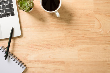 Flay lay, Top view office table desk with smartphone, keyboard, coffee, pencil, leaves with copy space background.