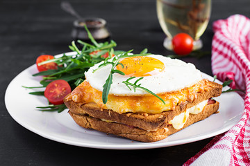 Breakfast. French cuisine. Croque madame sandwich close up on the table.