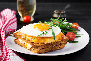 Breakfast. French cuisine. Croque madame sandwich close up on the table.