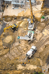 Aerial view of concrete bored pile foundation work on a construction site. 