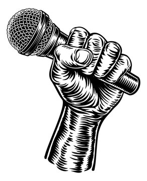 A fist hand holding a microphone or mic in a vintage intaglio woodcut engraved or retro propaganda style