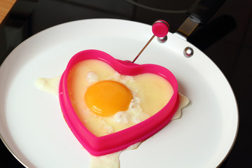 Frying Egg Sunny Side Up in Heart Shape Egg Ring