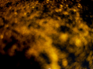 golden glitter sparkle isolated on black background