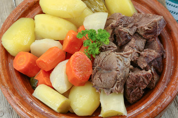 dish of pot au feu with beef on a table