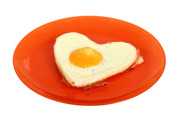 Fried Egg Sunny Side Up in Heart Shape. Isolated with clipping path.
