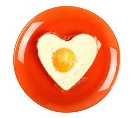 Fried Egg Sunny Side Up in Heart Shape. Isolated with clipping path.