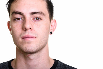 Fototapeta premium Studio shot of young handsome man isolated against white background