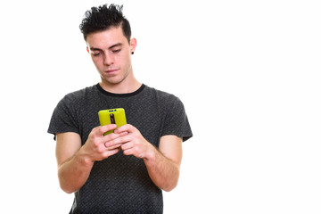 Studio shot of young handsome man isolated against white background