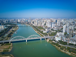 Fototapeta premium Aerial photos of high-rise residential area along the river and bridge across the river in the city