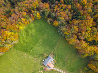 Aerial view of farm house and barn in rural area in Switzerland. Concept of organic agriculture.