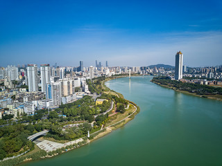 Aerial photos of high-rise residential areas and parks along the river in the city