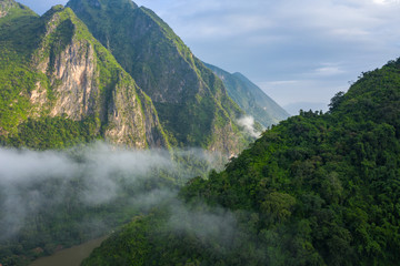 Aerial view of mountains in Nong Khiaw. North Laos. Southeast Asia. Photo made by drone from above. Bird eye view.
