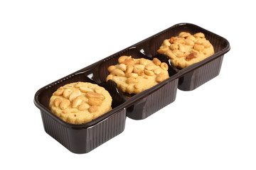 Peanut сookies in disposable plastic packing box. Isolated with clipping path.