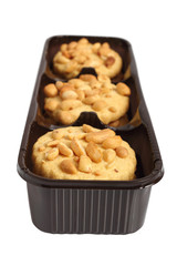 Peanut сookies in disposable plastic packing box. Isolated with clipping path.