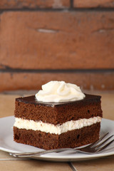 Chocolate Sponge Cake filled with whipped cream. Cream Pie.