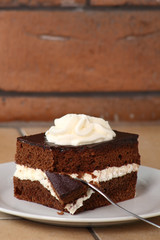 Chocolate Sponge Cake filled with whipped cream. Cream Pie.