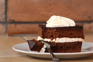 Chocolate Sponge Cake filled with whipped cream. Cream Pie.