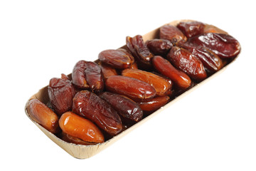Dry dates in box. Isolated on white background.