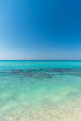 The most famous beach of Cyprus with crystal clear water. Nissi Beach.