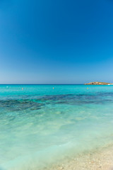 Fototapeta premium The most famous beach of Cyprus with crystal clear water. Nissi Beach.
