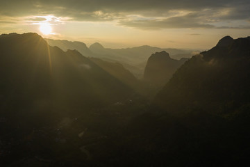 Fototapeta na wymiar Aerial view of sunset in Nong Khiaw. North Laos. Southeast Asia. Photo made by drone from above. Bird eye view.