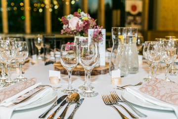 Beautiful table set for some festive event, party or wedding reception. Design, formal. Closeup