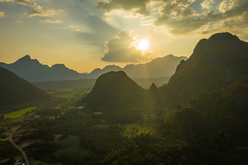 Fototapeta na wymiar Aerial view of beautiful sunset at Vang Vieng , Laos. Southeast Asia. Photo made by drone from above. Bird eye view.
