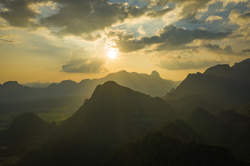 Aerial view of beautiful sunset at Vang Vieng , Laos. Southeast Asia. Photo made by drone from above. Bird eye view.