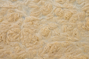Background of yellow foam on the water