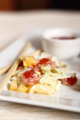 salad and chili sauce on plate