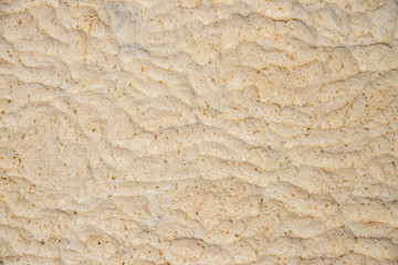 Background of yellow foam on the water