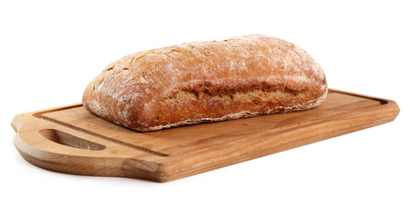 Loaf of rye bread on cutting board. Isolated with clipping path.