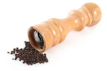 Wood Pepper Mill with black peppercorns. Isolated on white background.