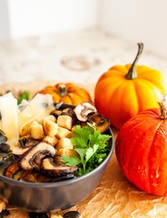 Pumpkin soup garnish with mushroom, seeds and croutons