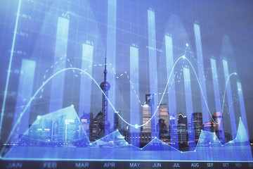 Forex chart on cityscape with tall buildings background multi exposure. Financial research concept.