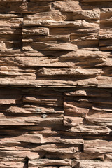 Abstract beige brown slate pattern stone block wall texture for background and wallpaper large and wide modern stone wall facade