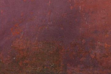 Fine texture of a rusty metal surface once painted red