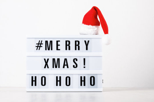 Christmas greeting card mock up. Light box with the text Merry Xmas and Christmas decoration - Powered by Adobe