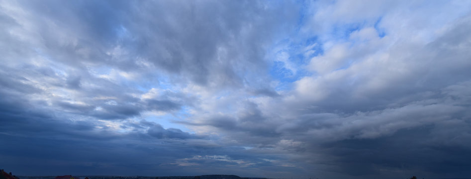 Heavy rain clouds. Photography, atmospheric phenomena, panoramic image of the autumn sky.