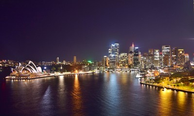 Fototapeta na wymiar Aerial Wide Shot of Sydney Skyline and Harbor at Night - Sydney, Australia 