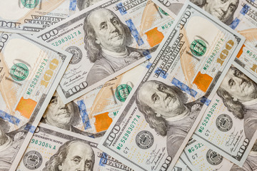 One hundred dollars pile as background