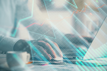 Double exposure of forex graph with man working on computer on background. Concept of market analysis.