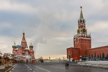 Saint Basil's Cathedral and Spasskaya tower in Red Square and colorful sky at winter morning.