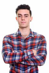 Portrait of young handsome hipster man with arms crossed