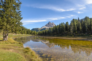 Fototapeta na wymiar Tre Cime di Lavaredo, aka Drei Zinnen, reflection in water of Antorno Lake Dolomites, Italy.