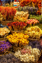 A large assortment of beautiful bouquets in a flower shop. Vertical.