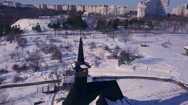 top view of a old wooden church in Kishinev, republic of Moldova. Winter landscape whit wooden church