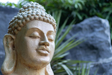 Low angle close up shot of Buddha statue. Enlightment concept